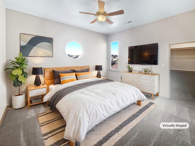 carpeted bedroom with ceiling fan