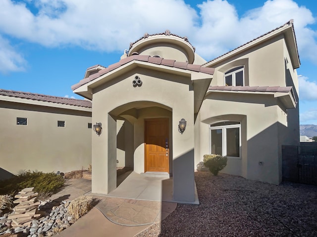 entrance to property featuring a patio area