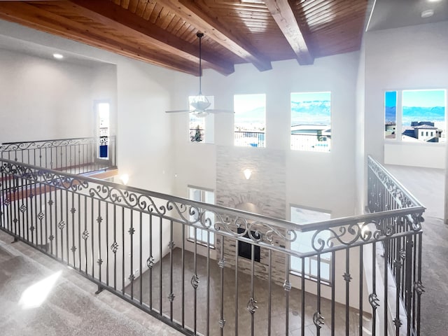 hallway featuring beamed ceiling and wooden ceiling