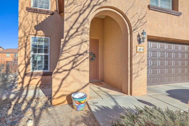 property entrance with a garage