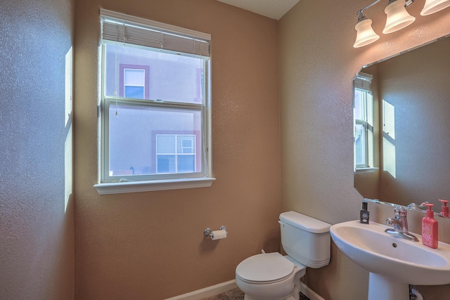 bathroom featuring sink and toilet