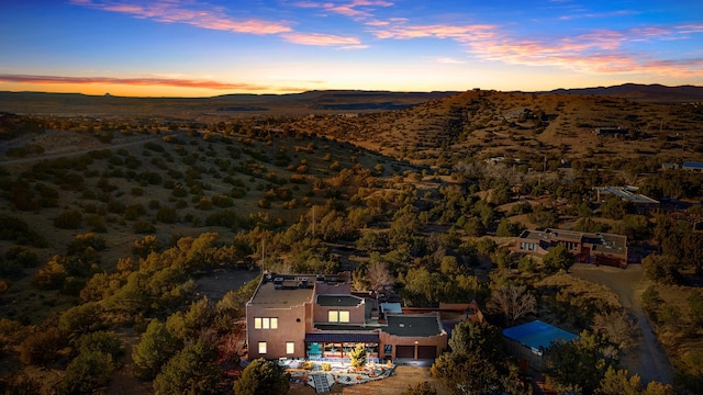 aerial view at dusk with a mountain view