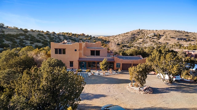 view of front of property with a mountain view