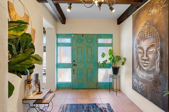 29 Sandia Ln, Placitas, NM 87043 - tiled entryway featuring a wealth of natural light, a chandelier, and beam ceiling