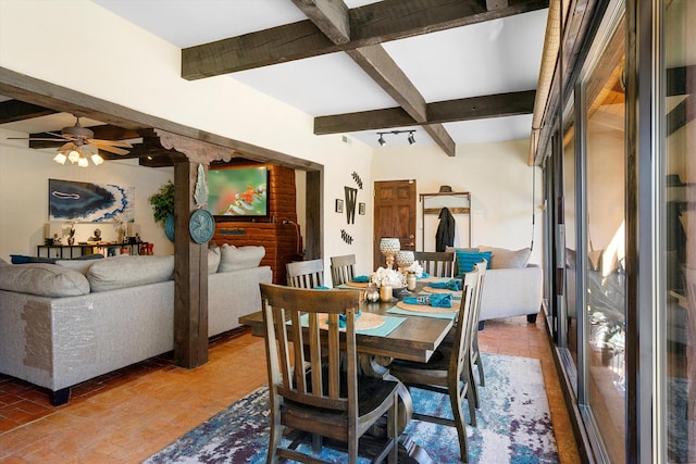 dining area with beamed ceiling and ceiling fan