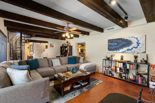 29 Sandia Ln, Placitas, NM 87043 - living room featuring a ceiling fan, stairs, brick floor, beam ceiling, and visible vents