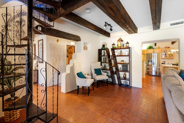 living room with beamed ceiling