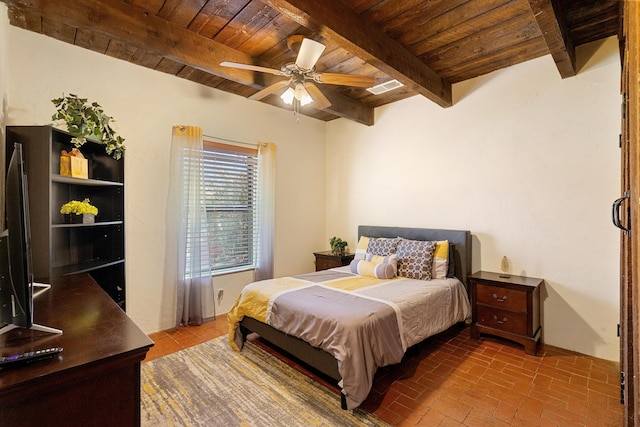 bedroom with beam ceiling, ceiling fan, and wood ceiling