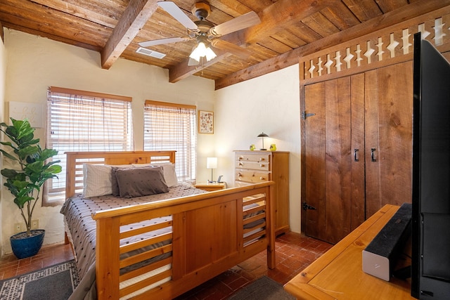 bedroom featuring beamed ceiling, ceiling fan, and wooden ceiling