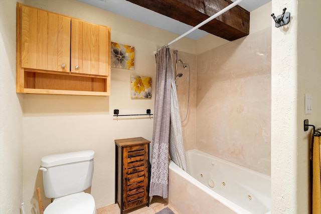 bathroom featuring shower / bath combo with shower curtain and toilet