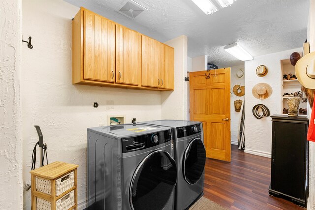 29 Sandia Ln, Placitas, NM 87043 - clothes washing area featuring separate washer and dryer, a textured wall, cabinet space, baseboards, and dark wood-type flooring