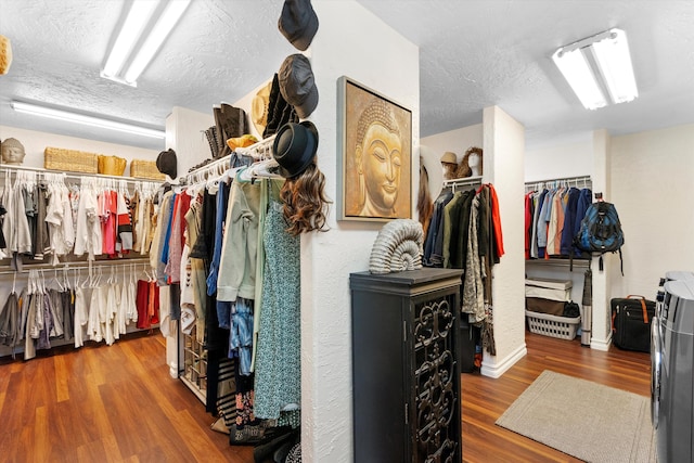 walk in closet with wood-type flooring