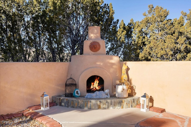 view of patio / terrace with an outdoor brick fireplace