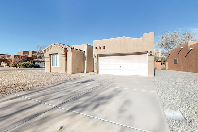 southwest-style home featuring a garage