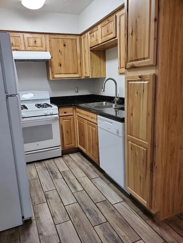 kitchen with sink and white appliances