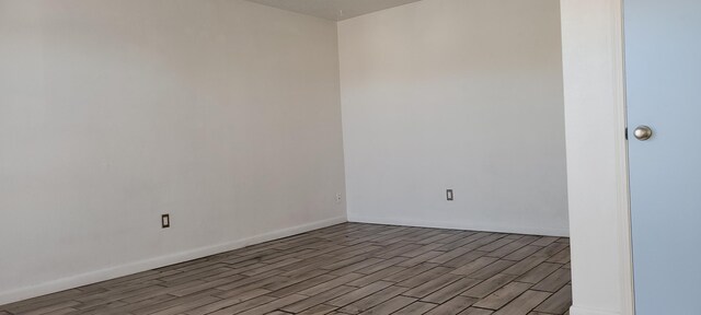 spare room with light wood-type flooring