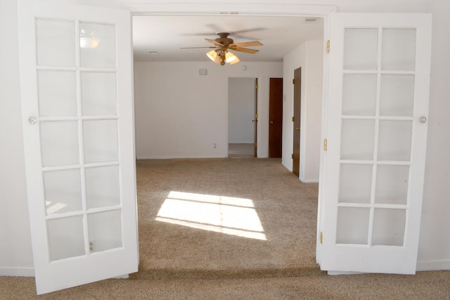 carpeted empty room with ceiling fan