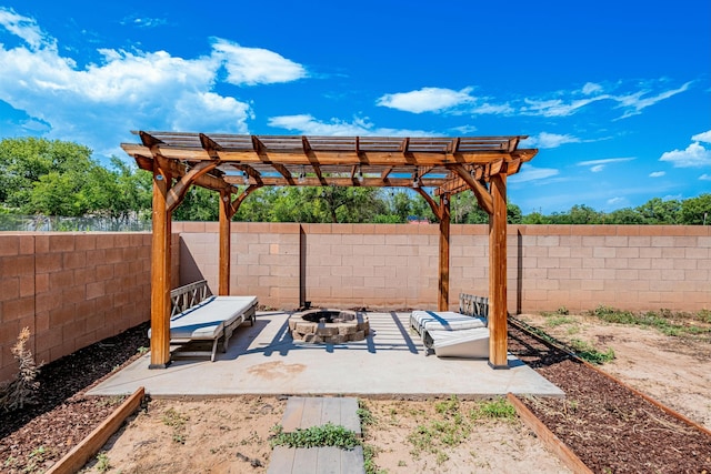 view of patio / terrace featuring a pergola and a fire pit