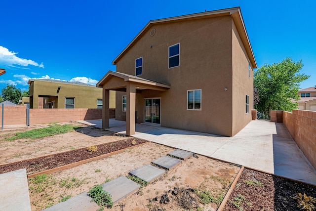 rear view of house featuring a patio area