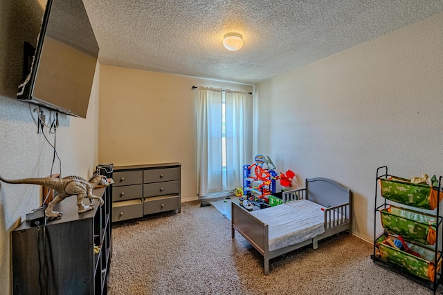 carpeted bedroom featuring a textured ceiling