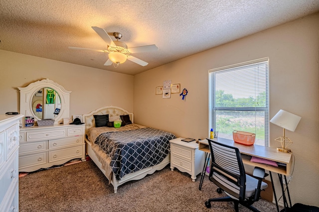 bedroom featuring ceiling fan, carpet, and a textured ceiling