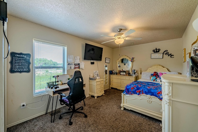 bedroom with ceiling fan, dark carpet, and a textured ceiling