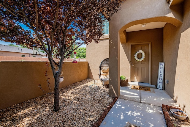 entrance to property featuring a patio area