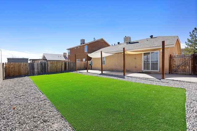 view of yard featuring a patio area and central air condition unit