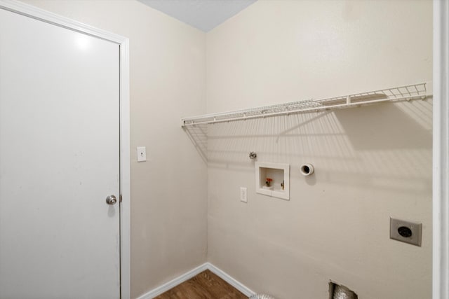 clothes washing area with hookup for a washing machine, gas dryer hookup, and electric dryer hookup