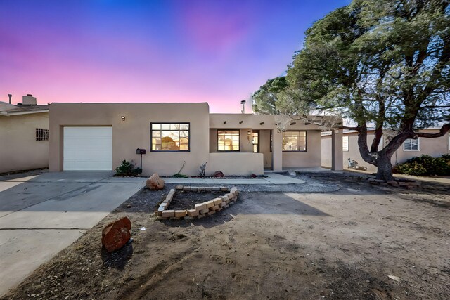 adobe home with a garage