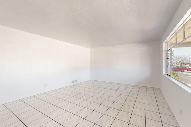 empty room featuring a textured ceiling