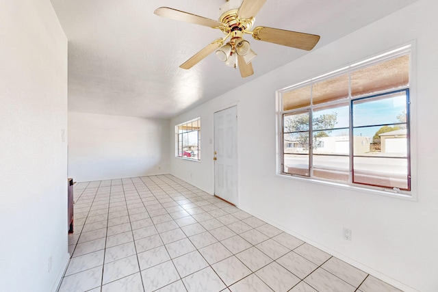 tiled entrance foyer with ceiling fan