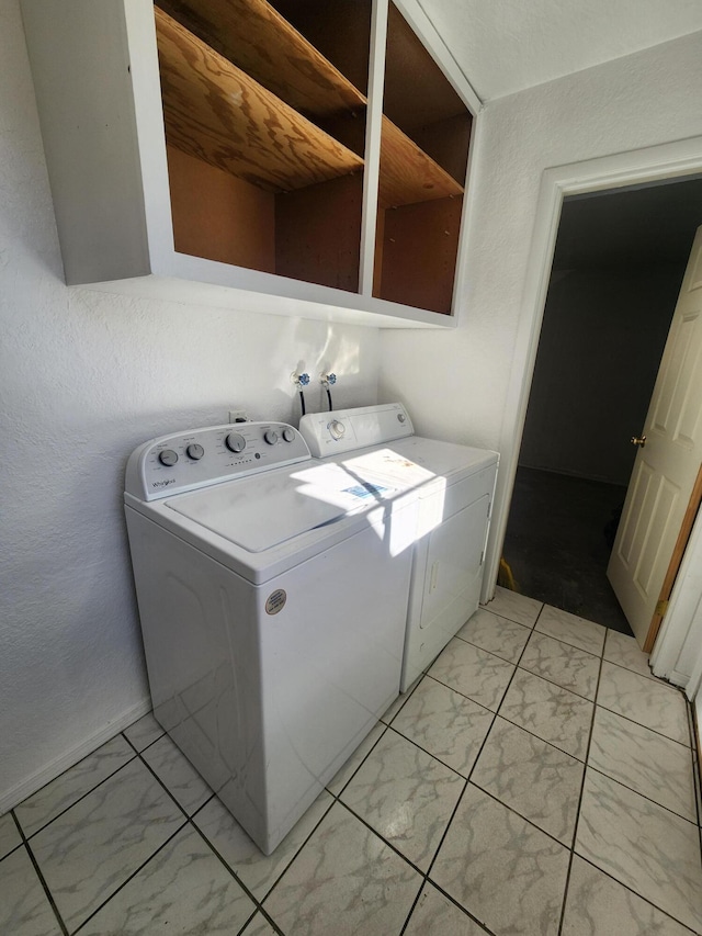 laundry area with washing machine and dryer