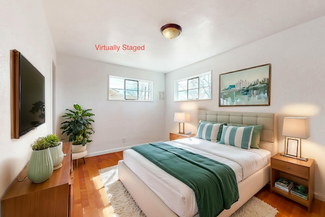 bedroom with light hardwood / wood-style flooring