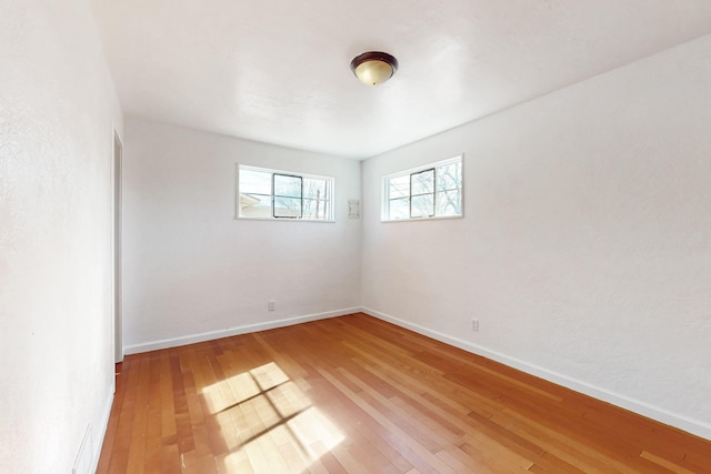 empty room featuring wood-type flooring