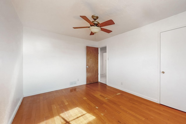 unfurnished bedroom with hardwood / wood-style flooring and ceiling fan