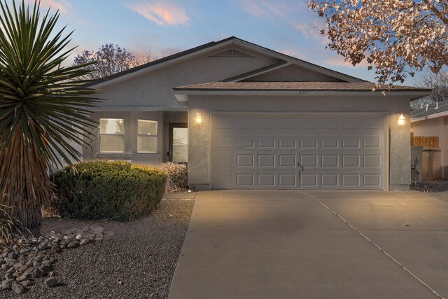 ranch-style house featuring a garage