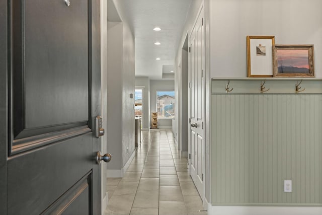 hallway with light tile patterned floors