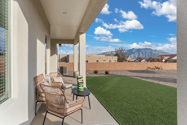 view of patio featuring central AC and a mountain view