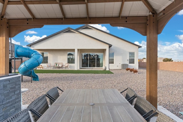 view of patio with central AC and a playground