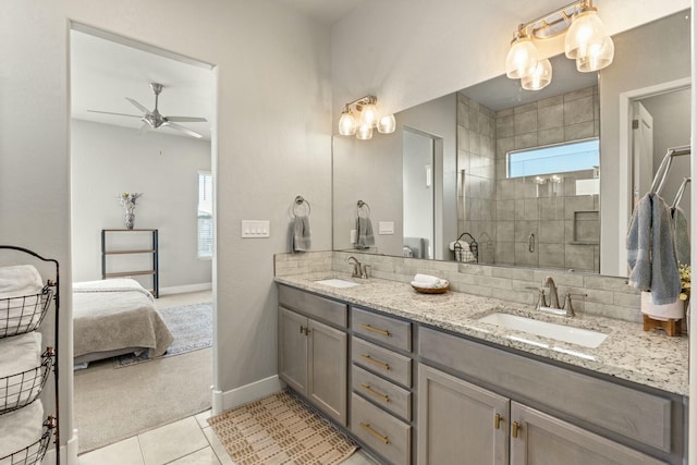 bathroom featuring ceiling fan, tile patterned floors, a shower with shower door, and a wealth of natural light