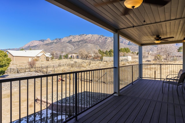 deck with a mountain view and ceiling fan