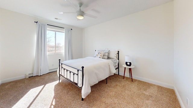 bedroom featuring ceiling fan, light carpet, and baseboard heating