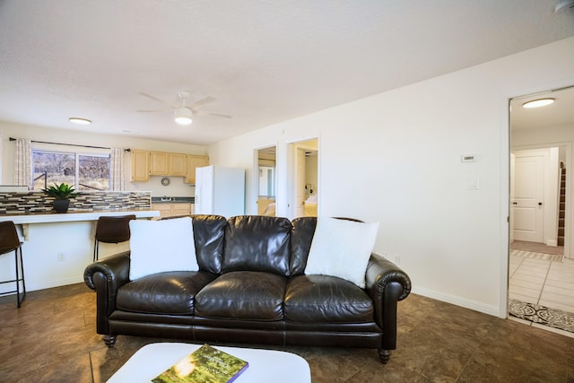 living room with ceiling fan