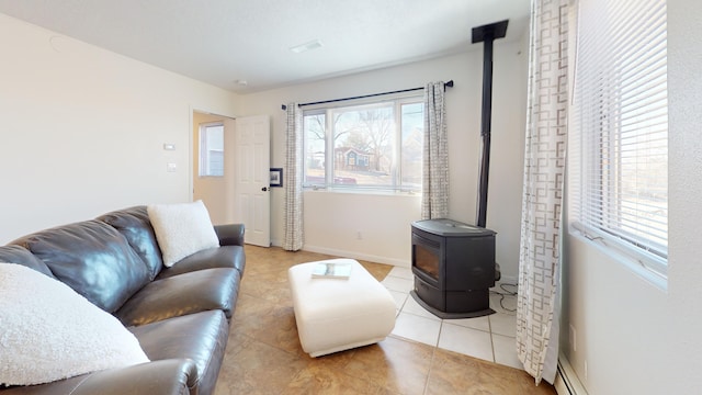 living room with light tile patterned flooring and a wood stove