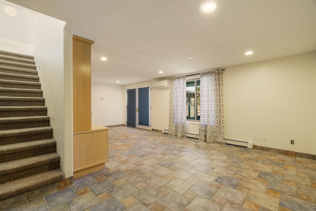 interior space featuring baseboard heating and an AC wall unit