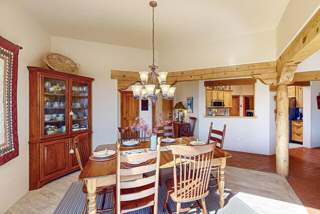 dining space with a chandelier