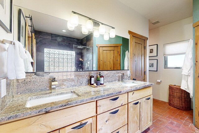 bathroom featuring vanity, a shower, and backsplash