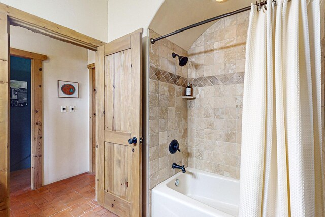 bathroom featuring shower / tub combo with curtain