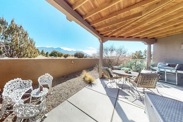 view of patio / terrace featuring a mountain view and area for grilling